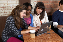 Teenagers using a laptop