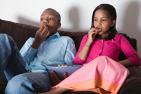 Brother and sister watching TV