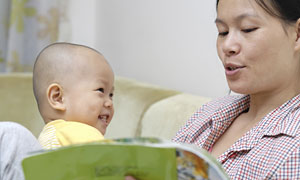 Mom reading to baby
