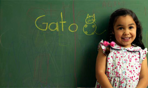 Girl with gato on blackboard